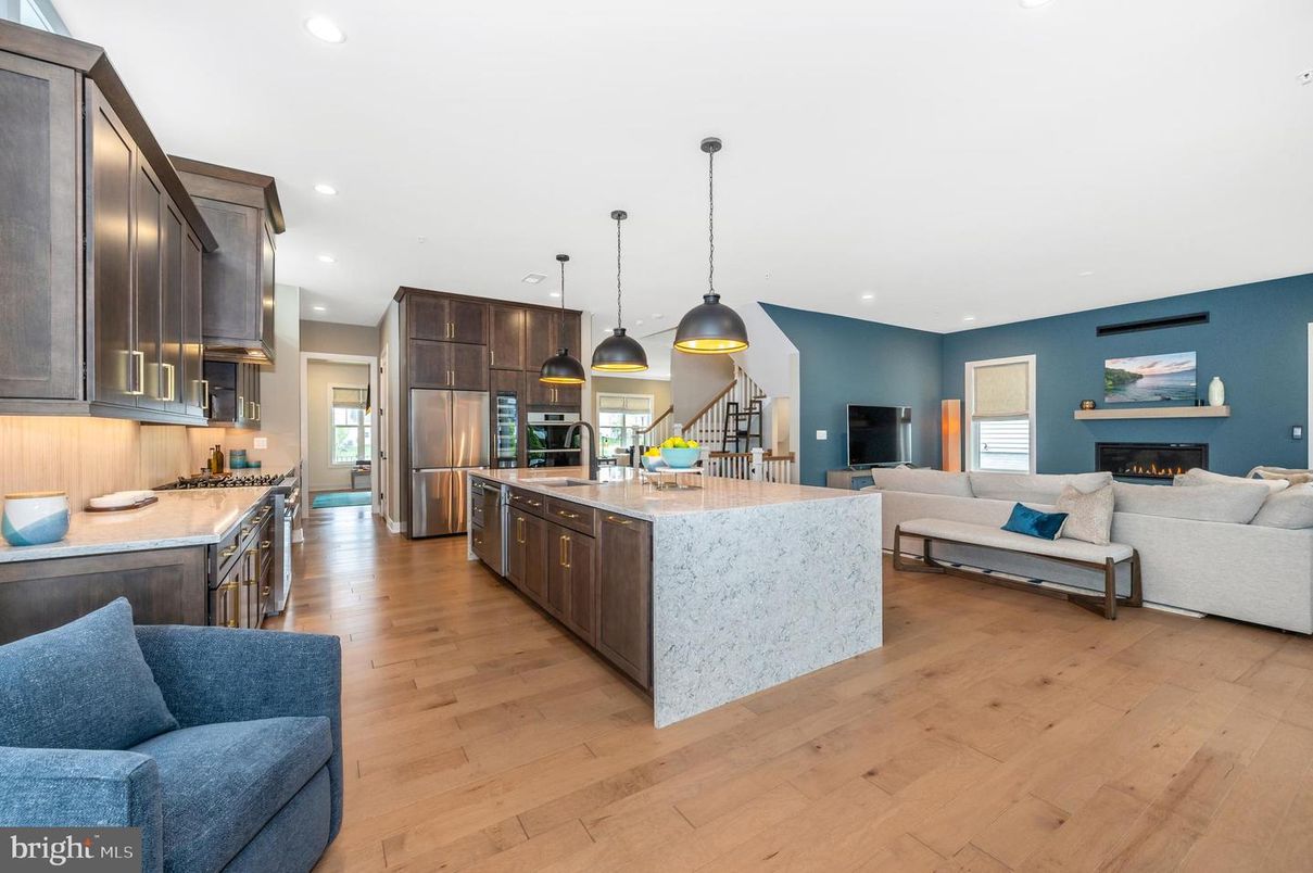 Fireplace, Interior, Kitchen, Living room, Pendant Lights, Recessed Lighting, Stainless Steel Appliances, Wood Texture Flooring