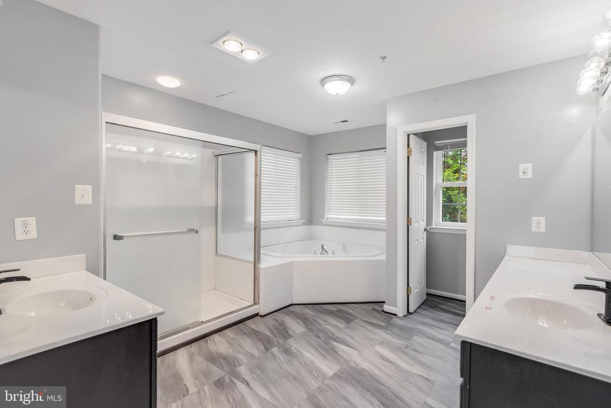 Bathroom, Dual Sink Vanities, Glass Shower, Interior, Recessed Lighting, Wood Texture Flooring