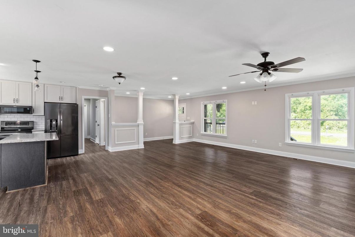 Empty room, Interior, Kitchen, Pendant Lights, Recessed Lighting, Stainless Steel Appliances, Wood Texture Flooring