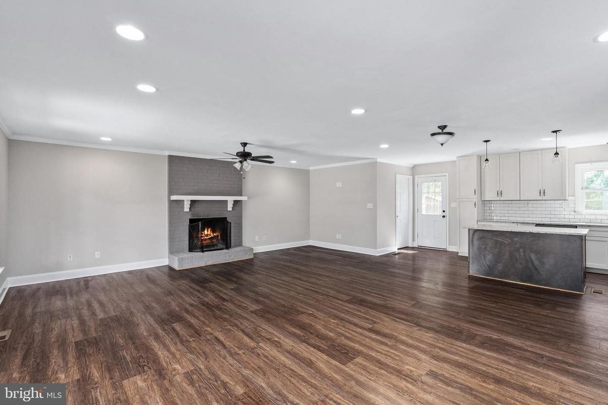 Empty room, Fireplace, Interior, Kitchen, Recessed Lighting, Wood Texture Flooring