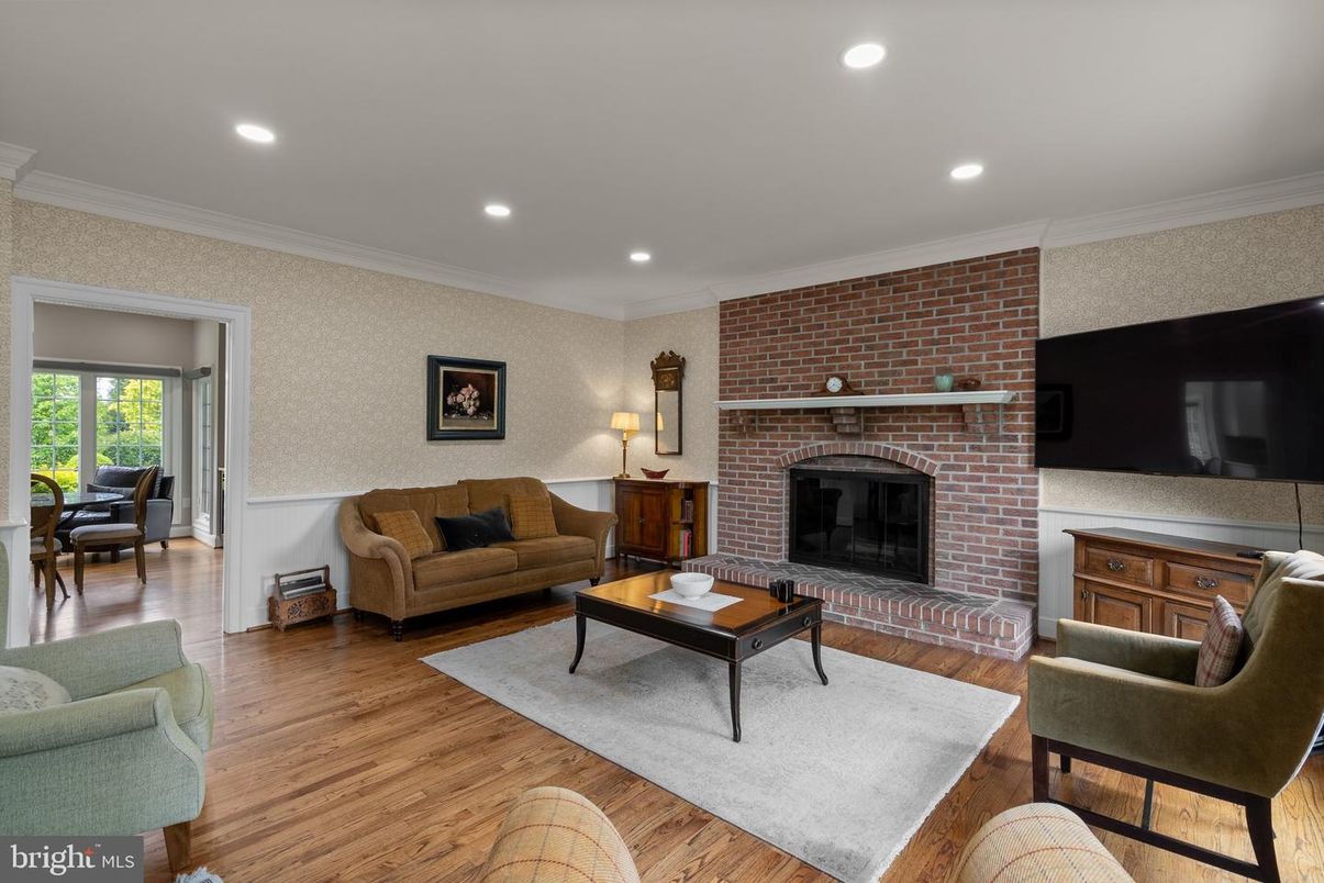 Fireplace, Interior, Living room, Recessed Lighting, Stone Walls, Wood Texture Flooring