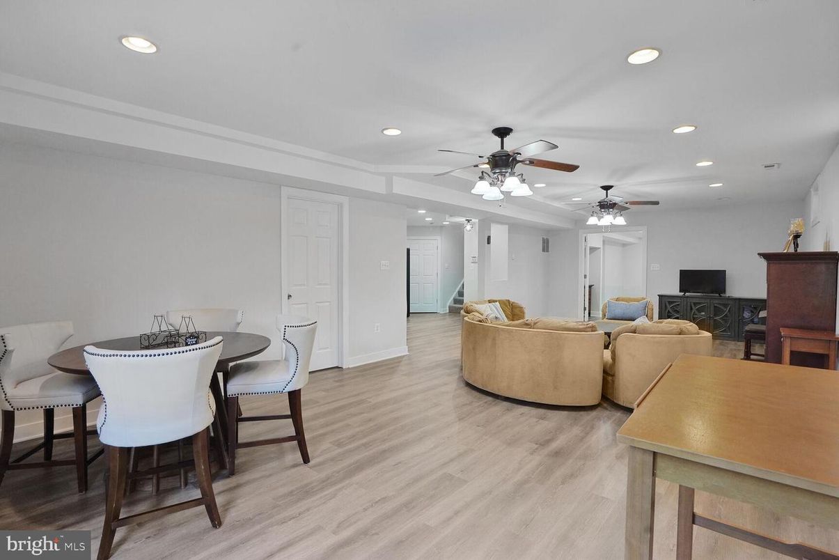 Dining room, Fireplace, Interior, Living room, Recessed Lighting, Wood Texture Flooring