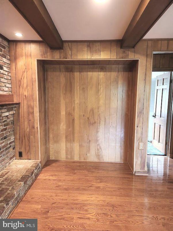 Empty room, Fireplace, Interior, Recessed Lighting, Stone Walls, Wood Texture Flooring, Wooden Walls