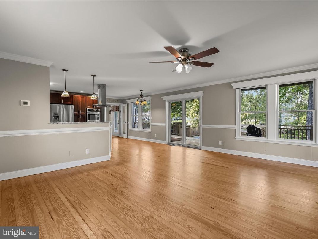 Empty room, Interior, Kitchen, Pendant Lights, Stainless Steel Appliances, Wood Texture Flooring