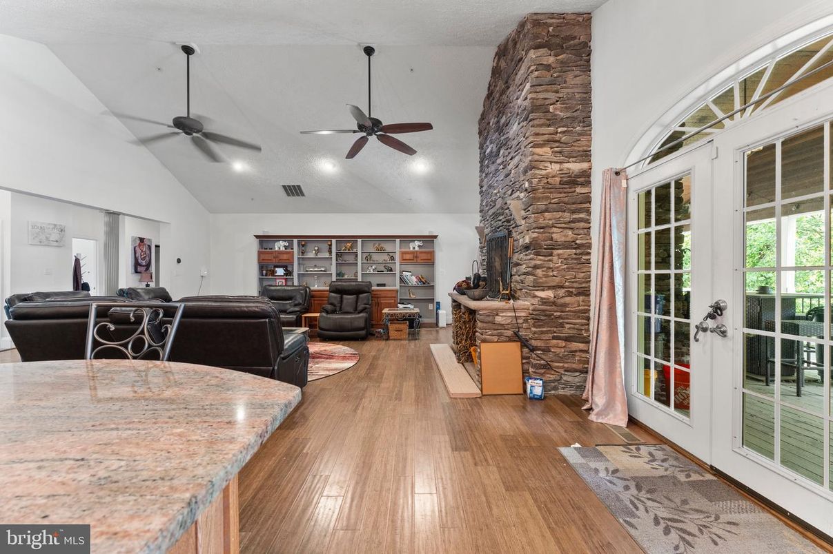Fireplace, Interior, Living room, Recessed Lighting, Stone Walls, Wood Texture Flooring