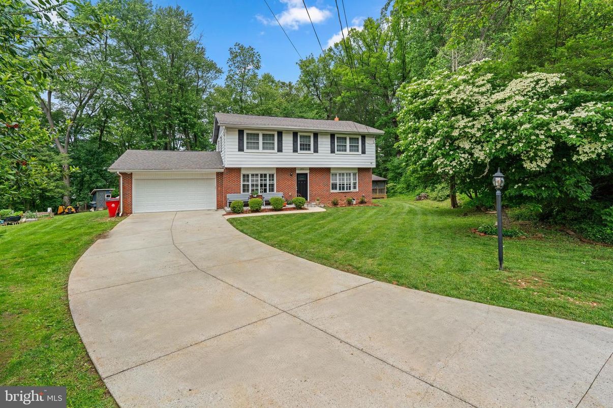 Attached, Backyard, Detached Garage, Exterior, Facade, Brick Facade, Raised Ranch