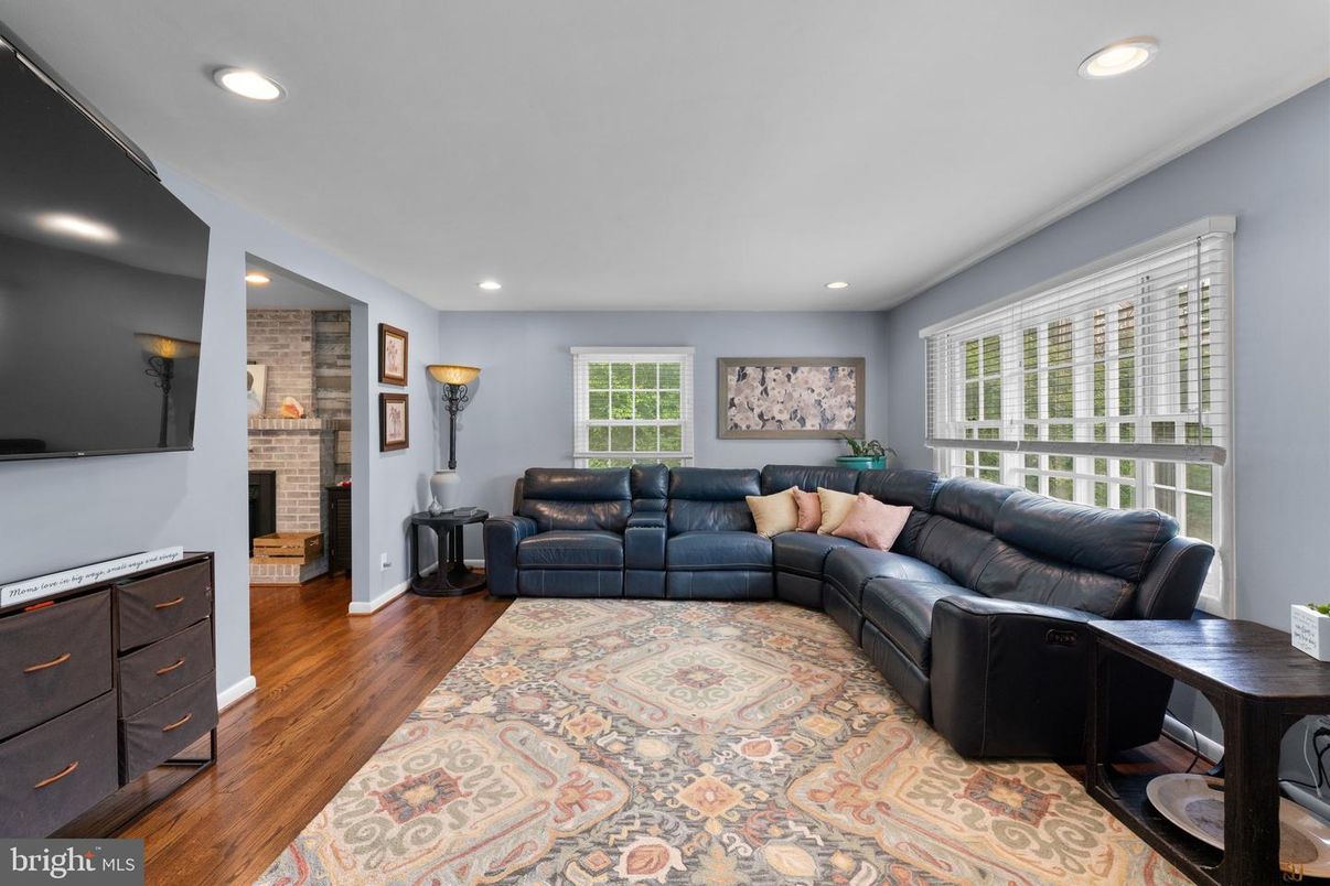 Fireplace, Interior, Living room, Recessed Lighting, Stone Walls, Wood Texture Flooring