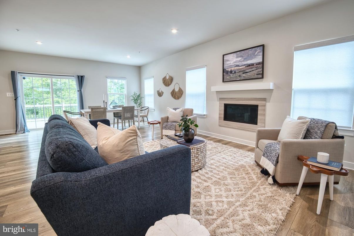 Dining room, Fireplace, Interior, Living room, Recessed Lighting, Water, Wood Texture Flooring