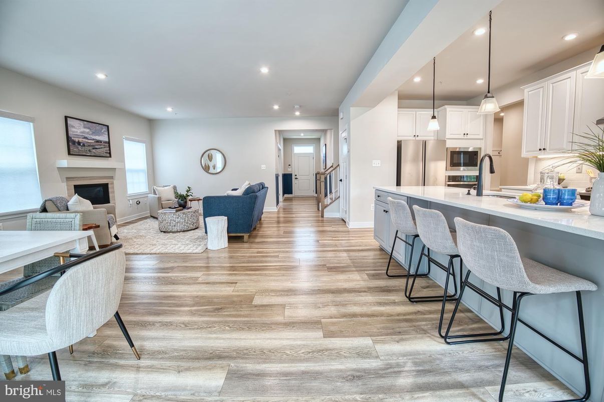Fireplace, Interior, Kitchen, Living room, Pendant Lights, Recessed Lighting, Stainless Steel Appliances, Wood Texture Flooring