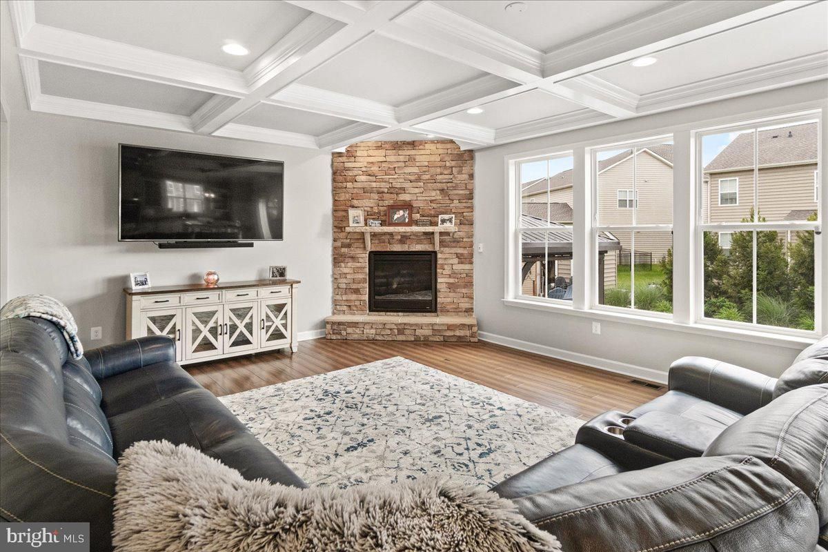 Fireplace, Interior, Living room, Recessed Lighting, Stone Walls, Wood Texture Flooring