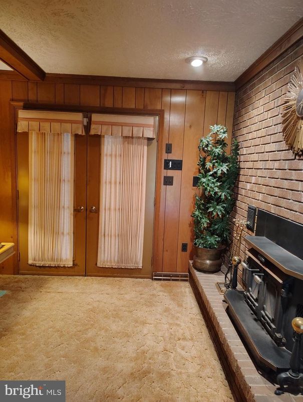 Fireplace, Fitness Equipment, Interior, Recessed Lighting, Stone Walls, Wooden Walls