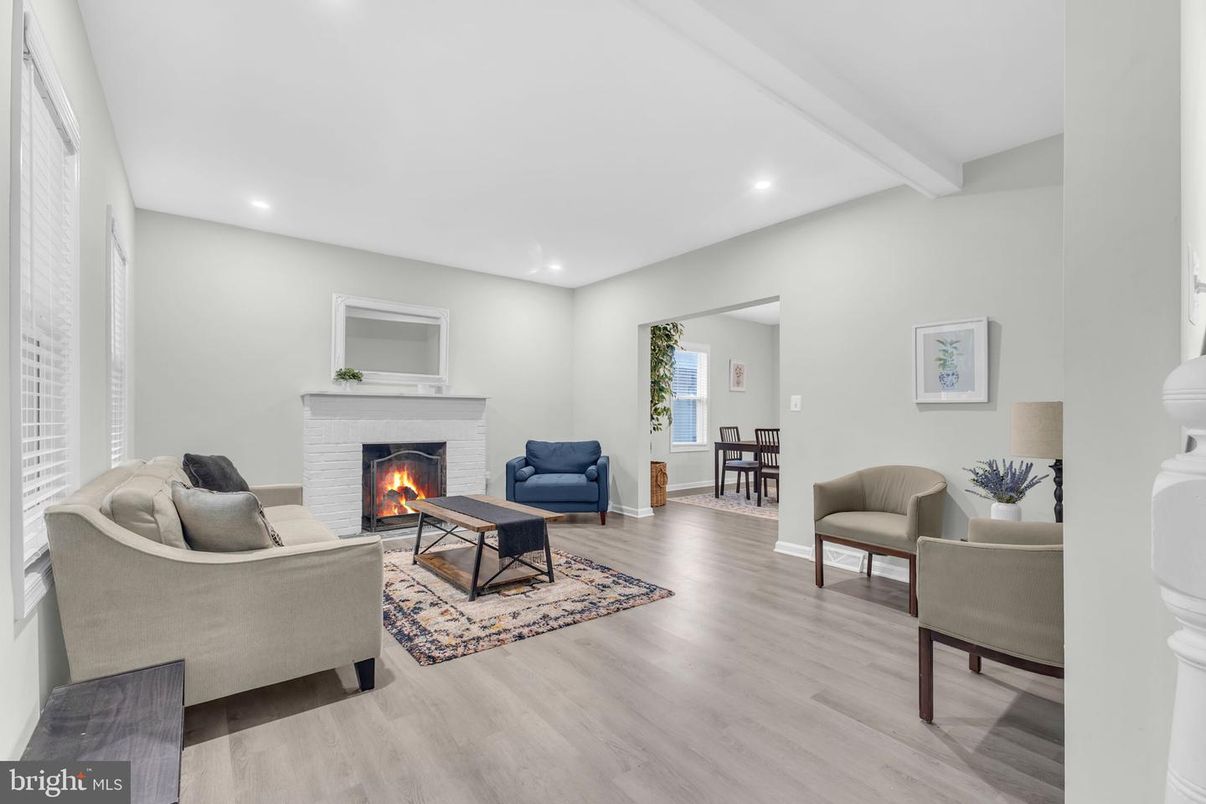 Dining room, Fireplace, Interior, Living room, Recessed Lighting, Wood Texture Flooring