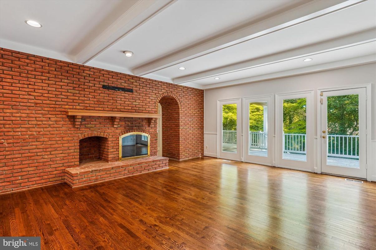 Empty room, Fireplace, Interior, Recessed Lighting, Stone Walls, Wood Texture Flooring