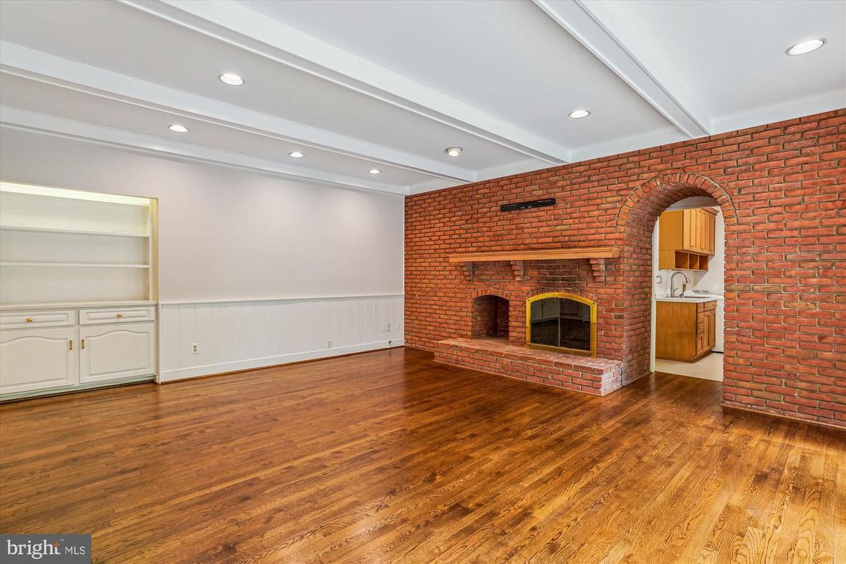 Empty room, Fireplace, Interior, Recessed Lighting, Stone Walls, Wood Texture Flooring