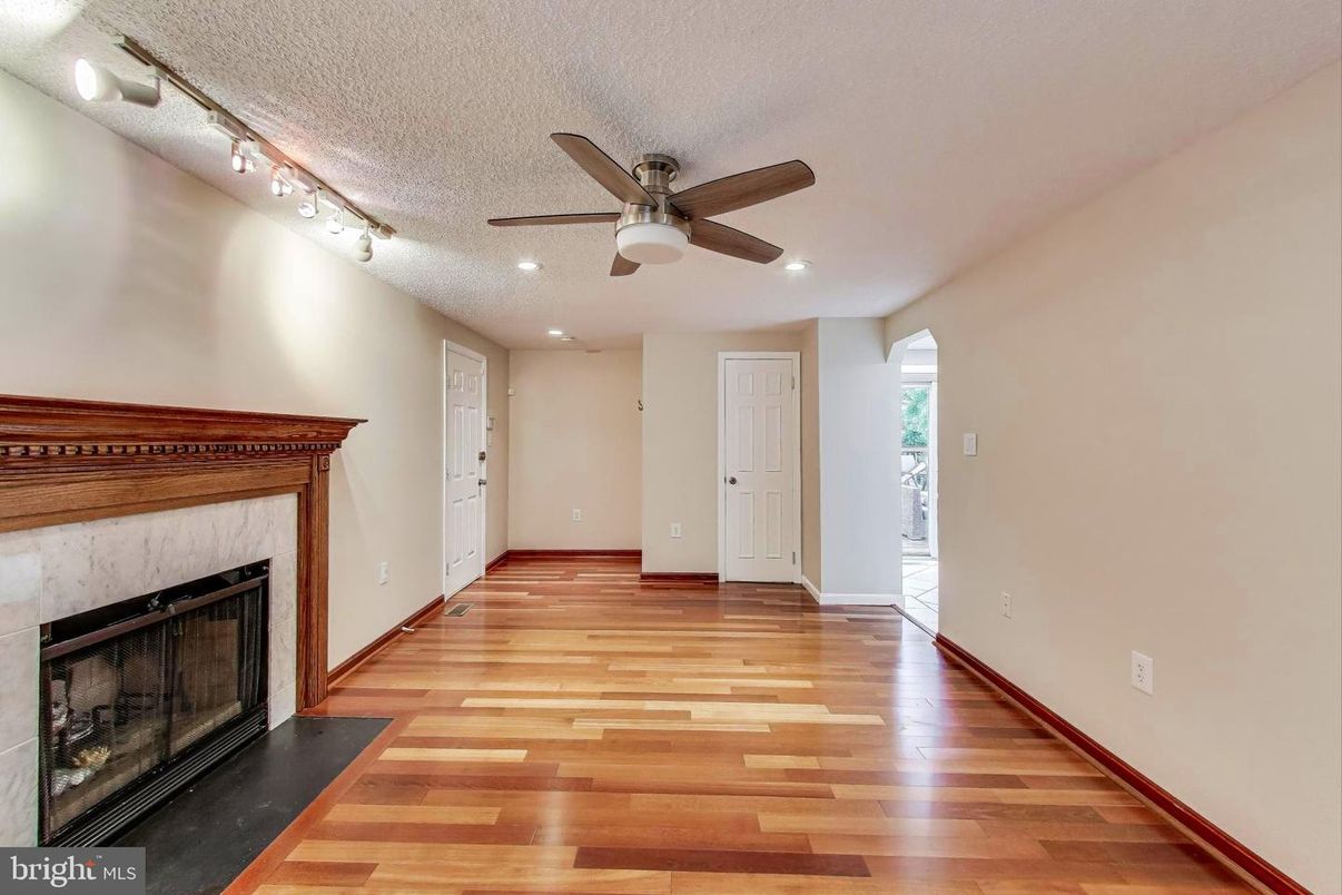 Empty room, Fireplace, Interior, Recessed Lighting, Wood Texture Flooring