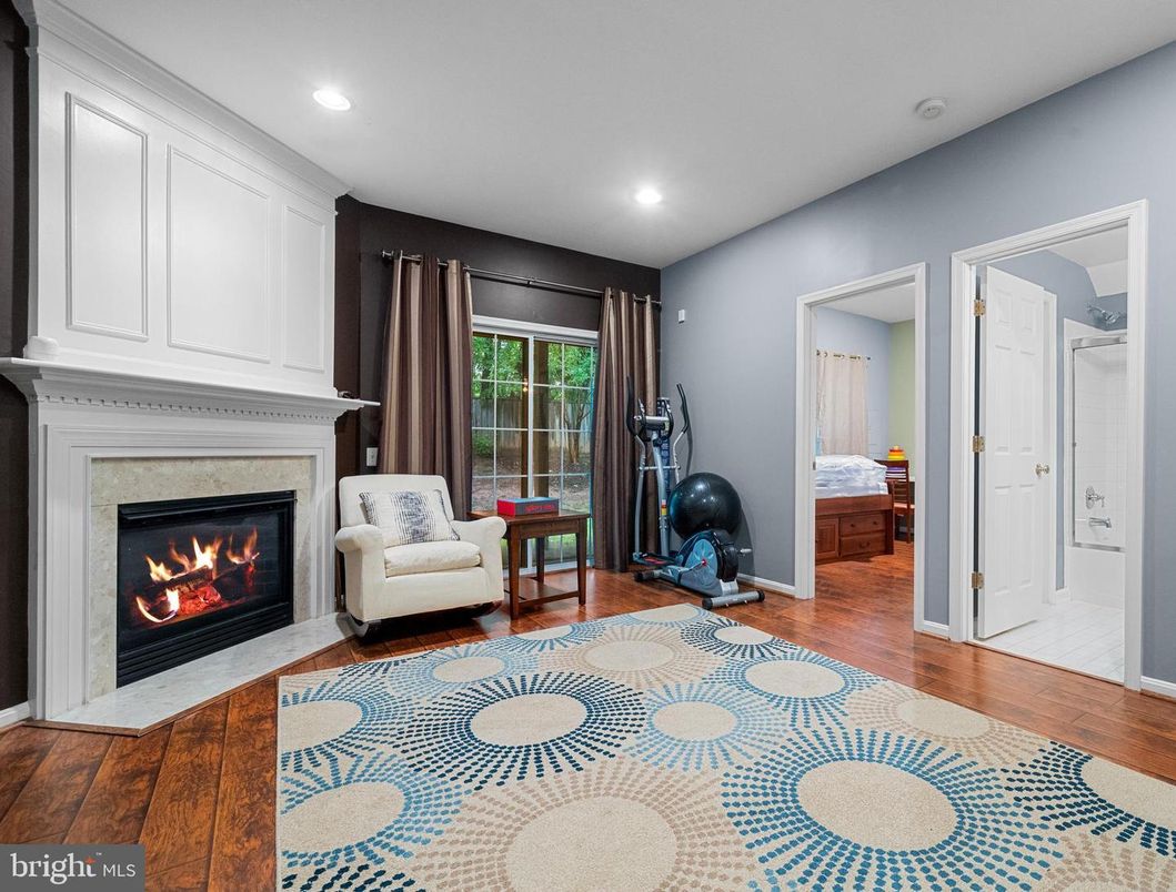 Fireplace, Fitness Equipment, Interior, Recessed Lighting, Wood Texture Flooring