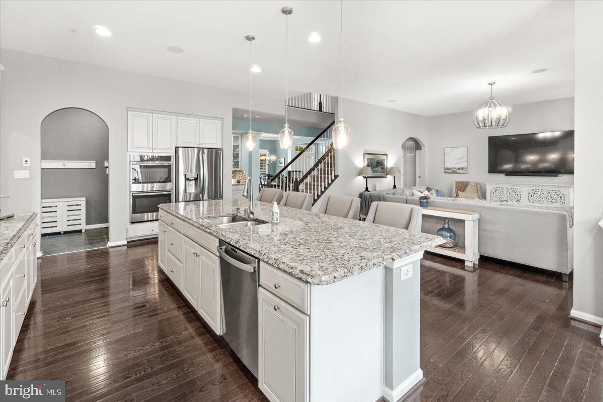 Chandelier, Dining room, Interior, Kitchen, Living room, Pendant Lights, Recessed Lighting, Stainless Steel Appliances, Wood Texture Flooring