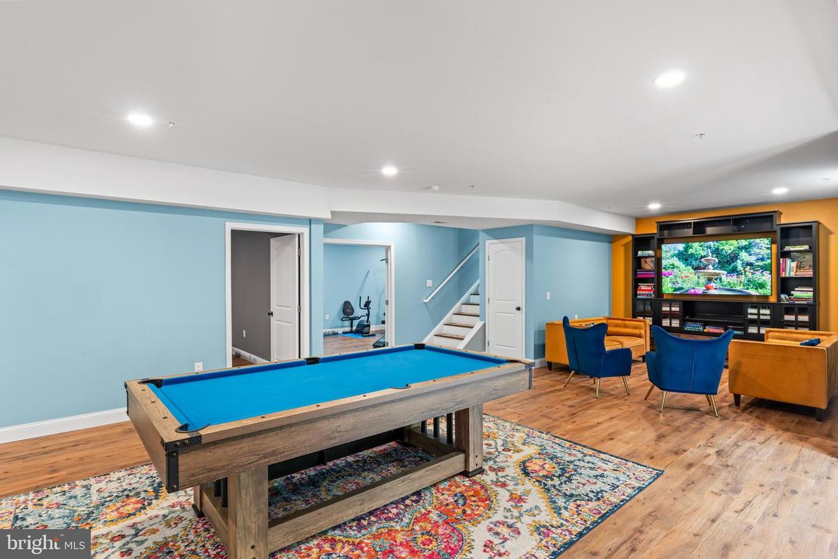 Billiard Table, Fitness Equipment, Game Room, Interior, Living room, Recessed Lighting, Wood Texture Flooring