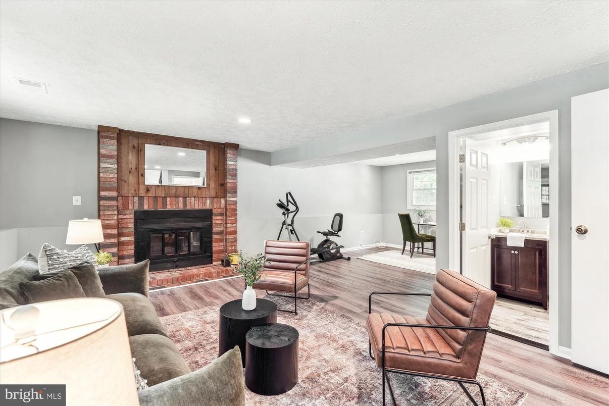 Fireplace, Fitness Equipment, Interior, Living room, Recessed Lighting, Wood Texture Flooring