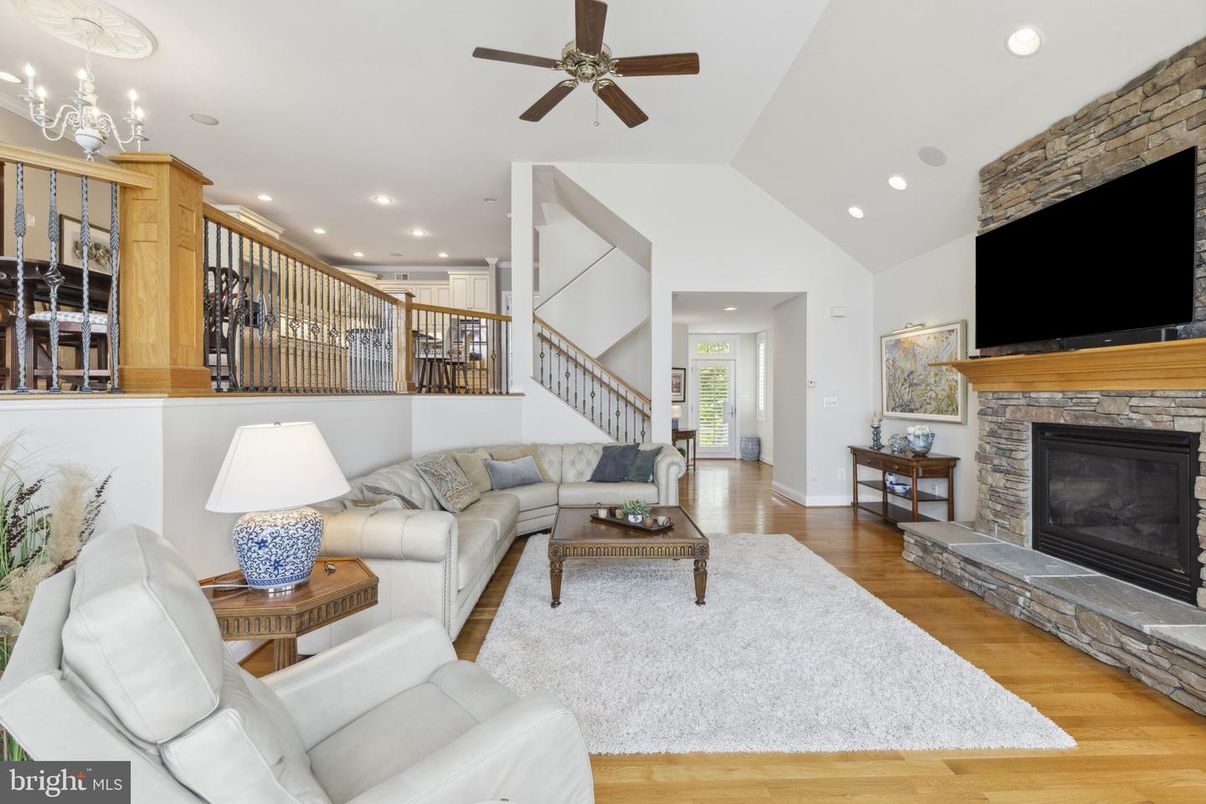 Fireplace, Interior, Living room, Recessed Lighting, Stone Walls, Wood Texture Flooring