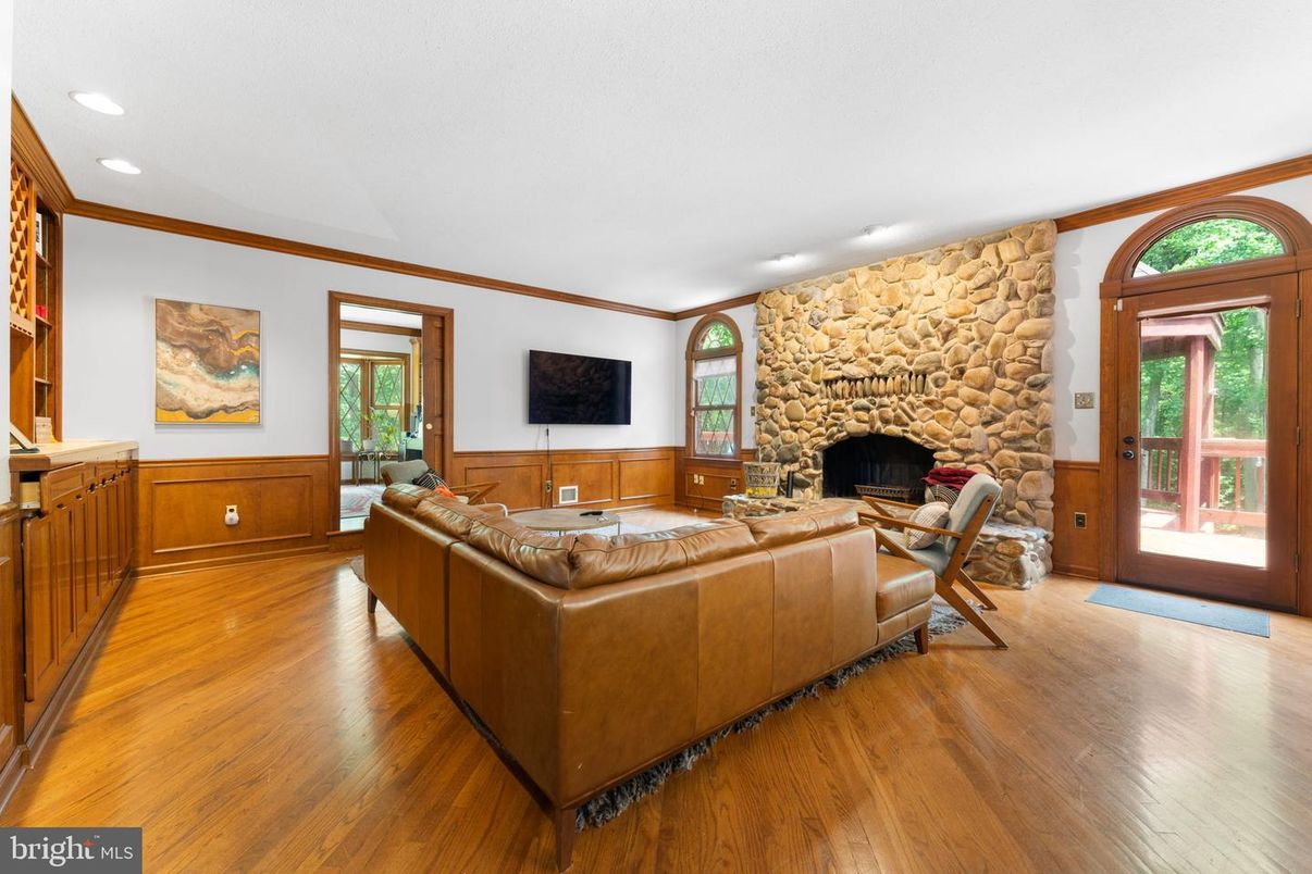 Fireplace, Interior, Living room, Recessed Lighting, Stone Walls, Wood Texture Flooring