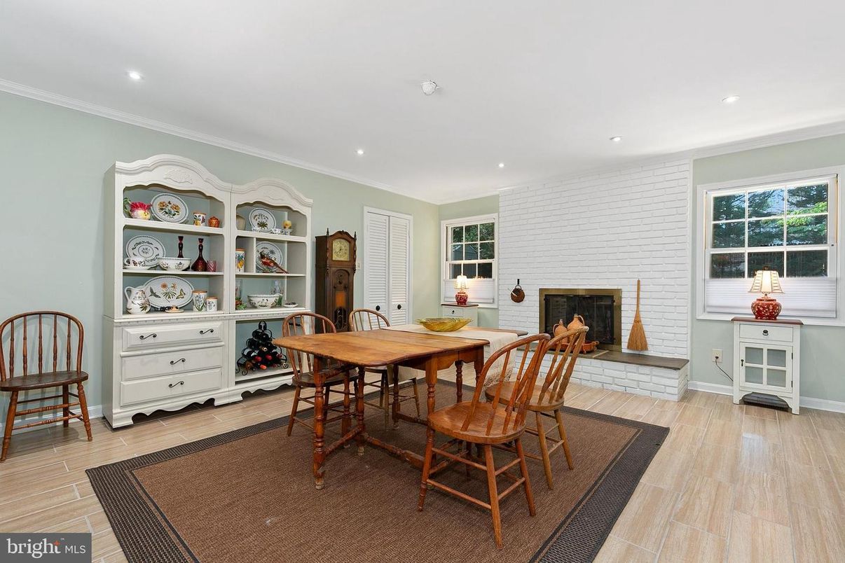 Dining room, Fireplace, Interior, Recessed Lighting, Stone Walls, Wood Texture Flooring
