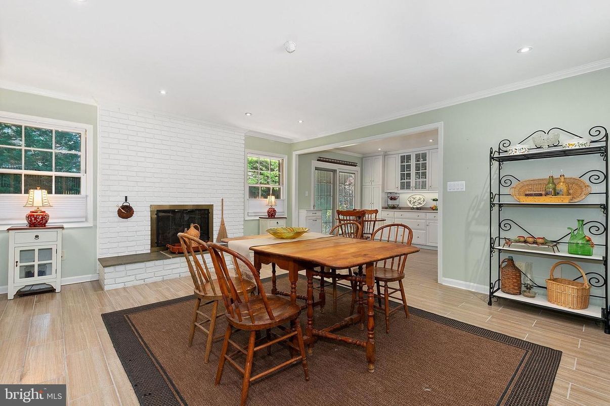 Dining room, Fireplace, Interior, Recessed Lighting, Stone Walls, Wood Texture Flooring