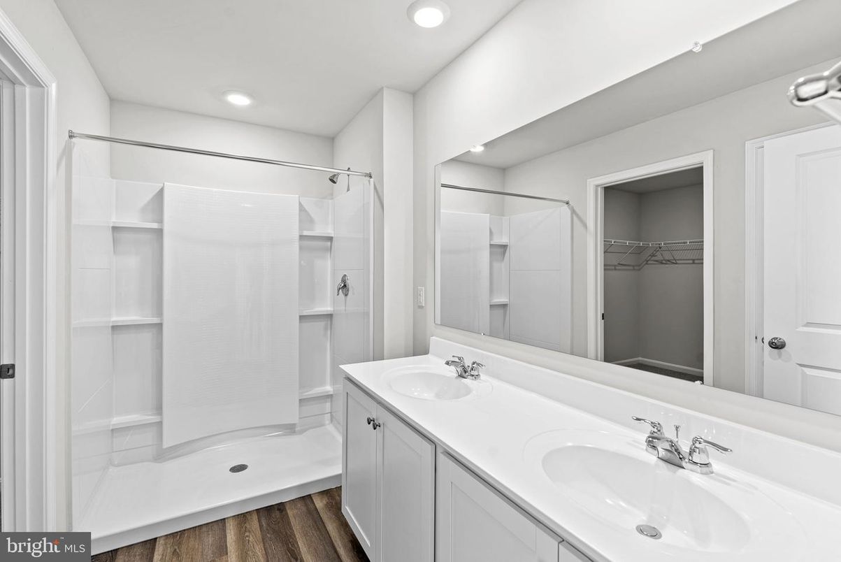 Bathroom, Dual Sink Vanities, Interior, Recessed Lighting, Walk-in Closets, Wood Texture Flooring