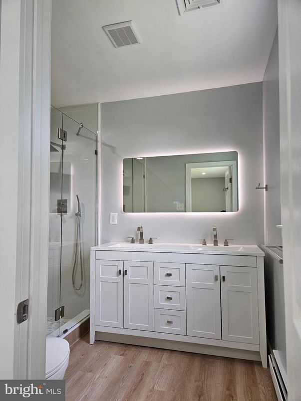 Bathroom, Dual Sink Vanities, Glass Shower, Interior, Wood Texture Flooring