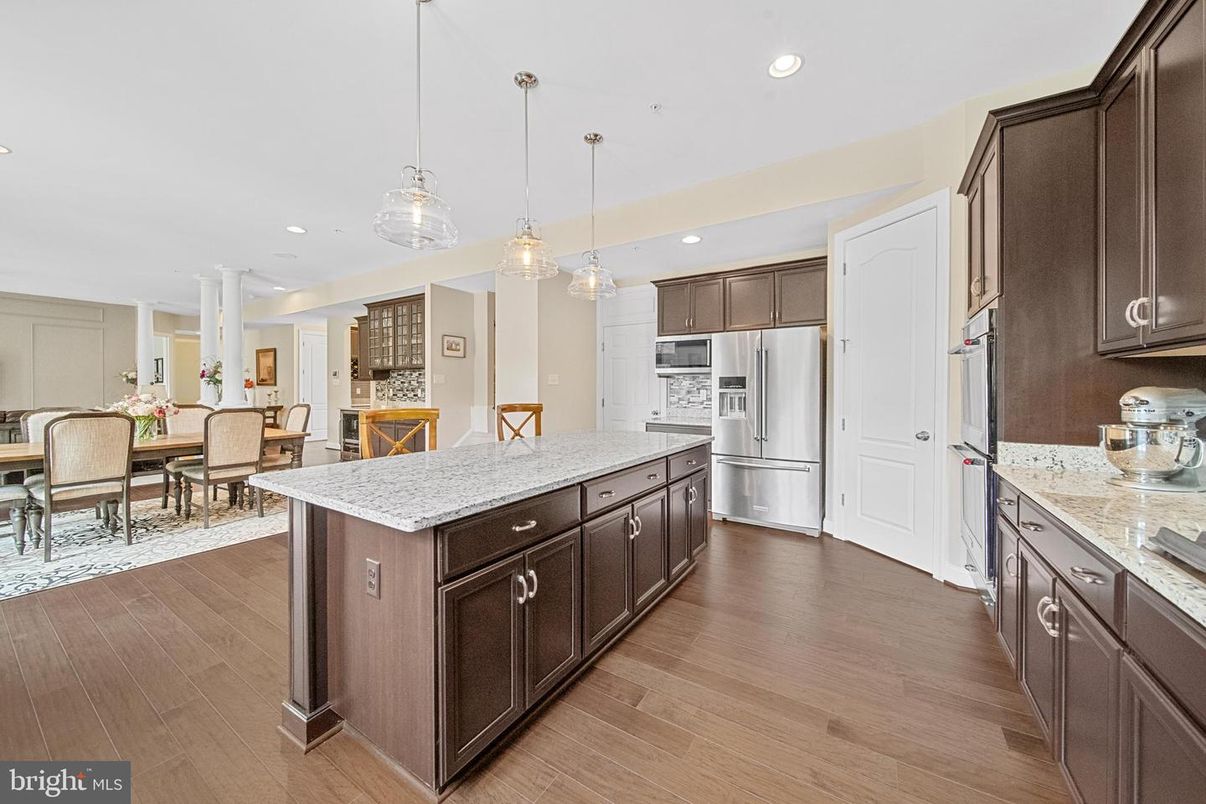 Dining room, Interior, Kitchen, Pendant Lights, Recessed Lighting, Stainless Steel Appliances, Wood Texture Flooring