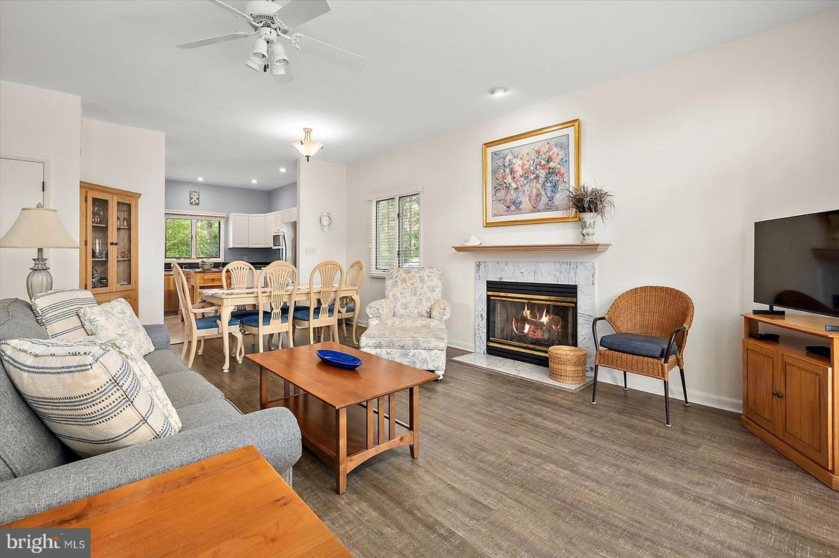 Dining room, Fireplace, Interior, Living room, Recessed Lighting, Wood Texture Flooring