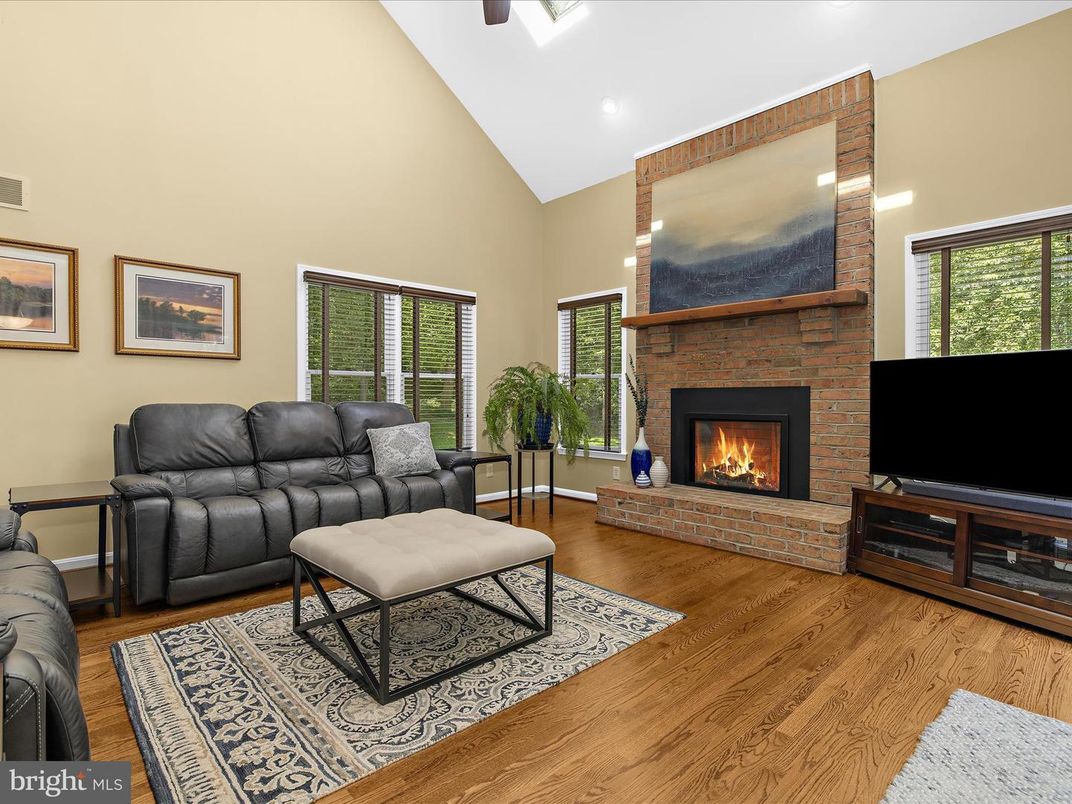 Fireplace, Interior, Living room, Recessed Lighting, Stone Walls, Wood Texture Flooring