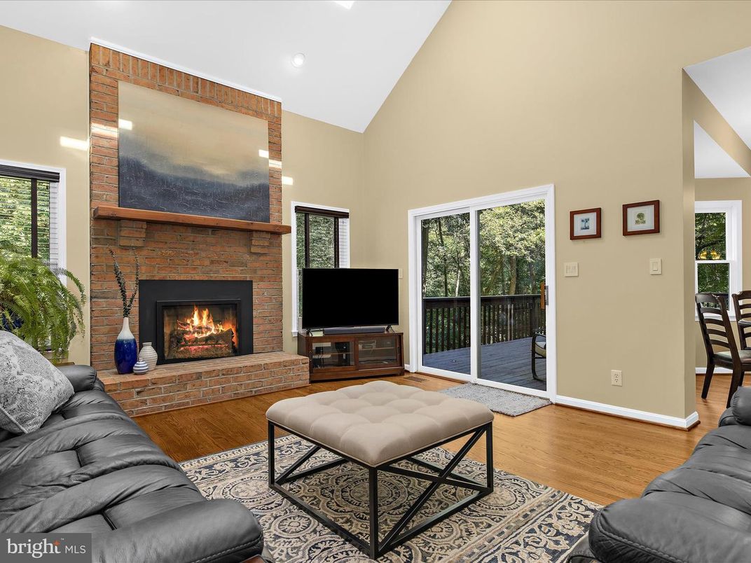 Fireplace, Interior, Living room, Recessed Lighting, Stone Walls, Wood Texture Flooring