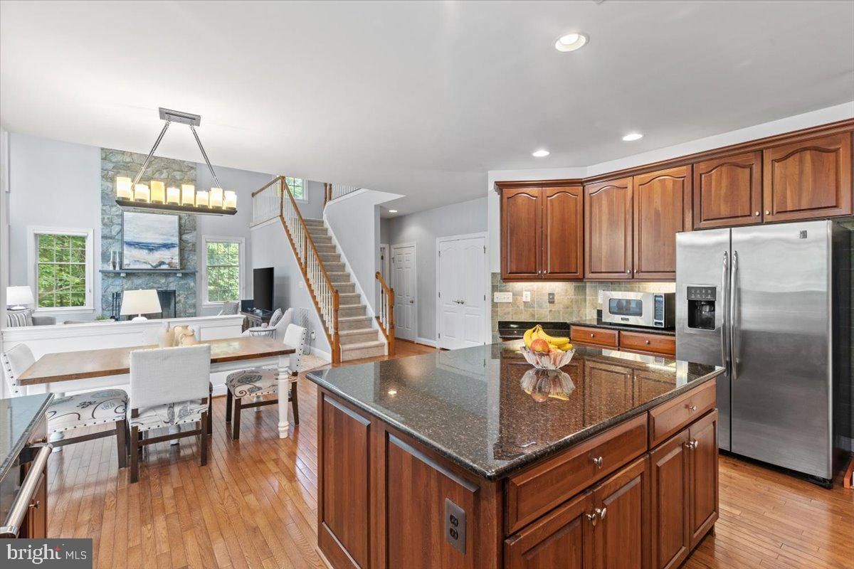 Chandelier, Dining room, Interior, Kitchen, Recessed Lighting, Stainless Steel Appliances, Wood Texture Flooring