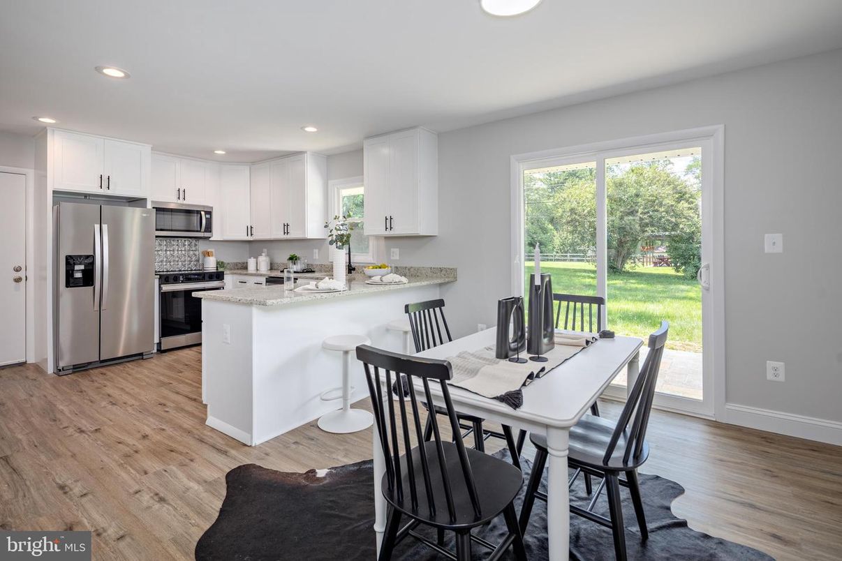 Dining room, Interior, Kitchen, Recessed Lighting, Stainless Steel Appliances, Wood Texture Flooring