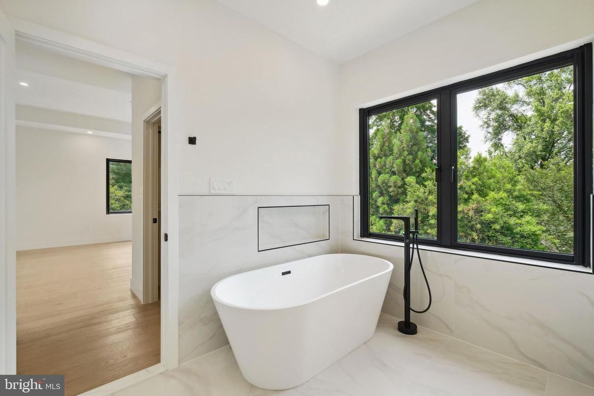 Bathroom, Free Standing Baths, Interior, Marble Walls, Recessed Lighting, Wood Texture Flooring