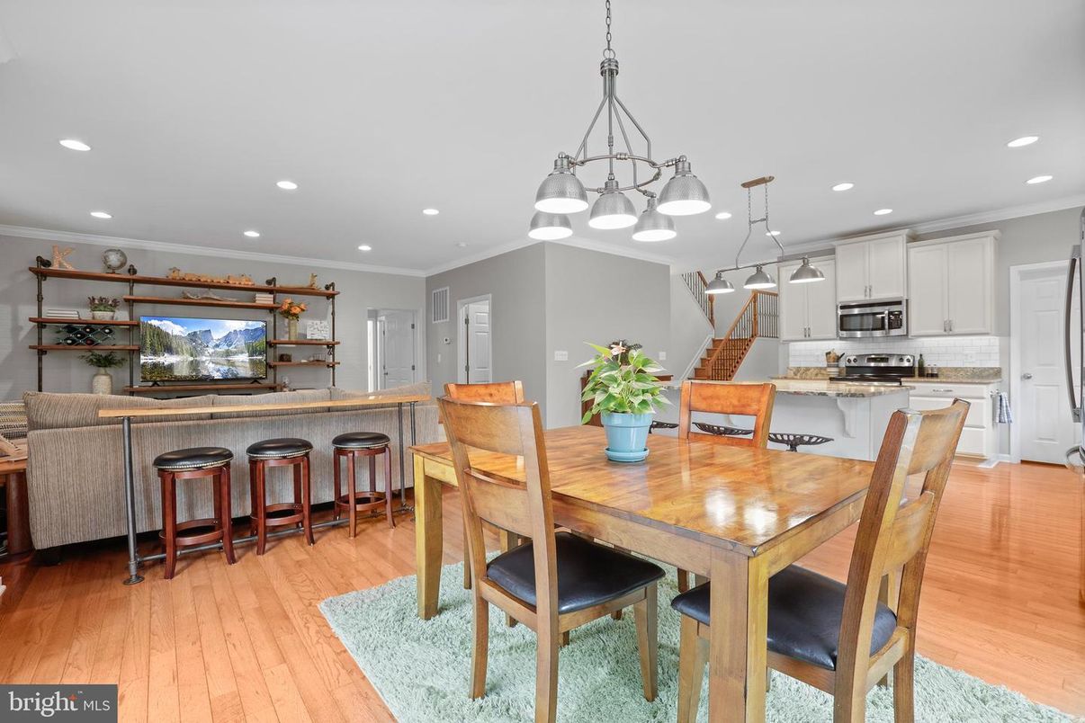 Dining room, Interior, Kitchen, Pendant Lights, Recessed Lighting, Stainless Steel Appliances, Wood Texture Flooring