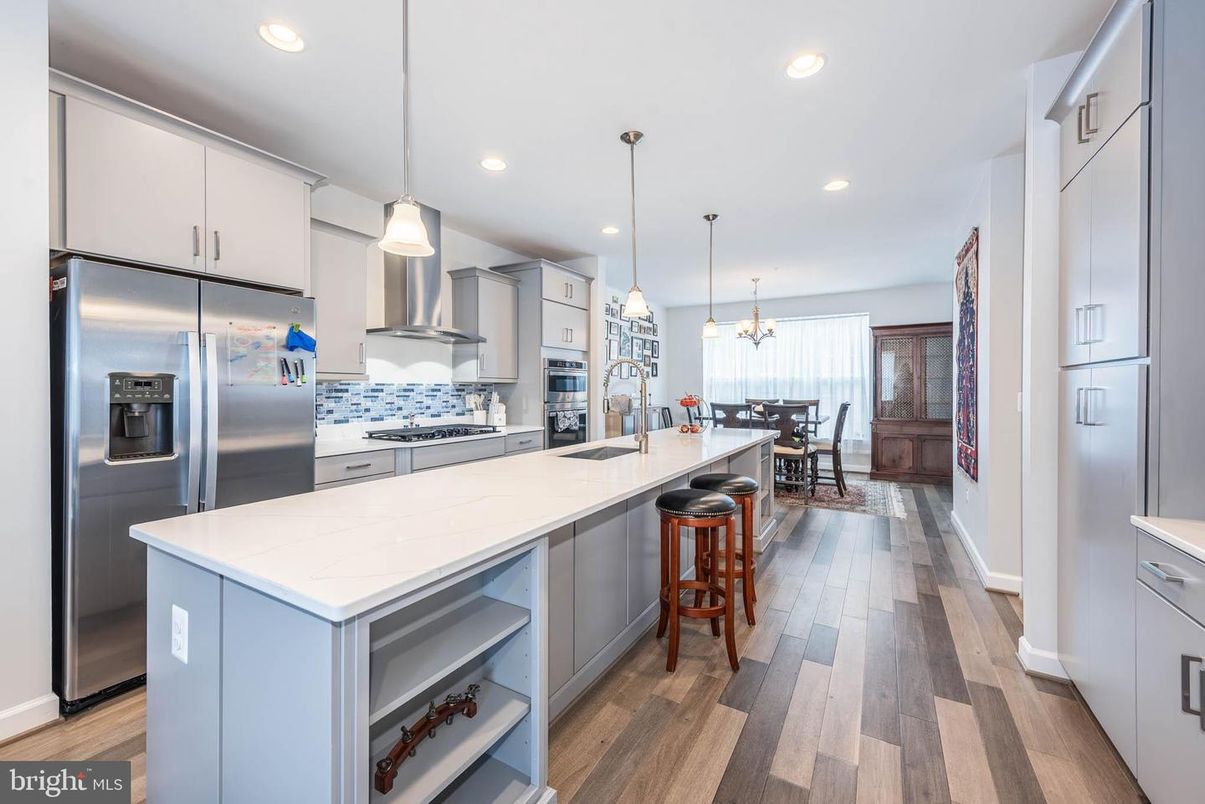 Chandelier, Dining room, Interior, Kitchen, Pendant Lights, Recessed Lighting, Stainless Steel Appliances, Wood Texture Flooring