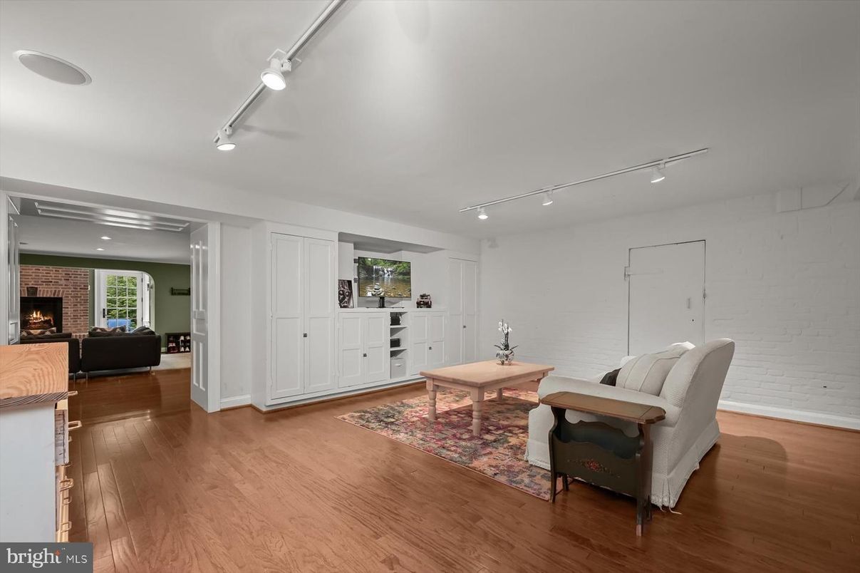 Fireplace, Interior, Living room, Recessed Lighting, Stone Walls, Wood Texture Flooring