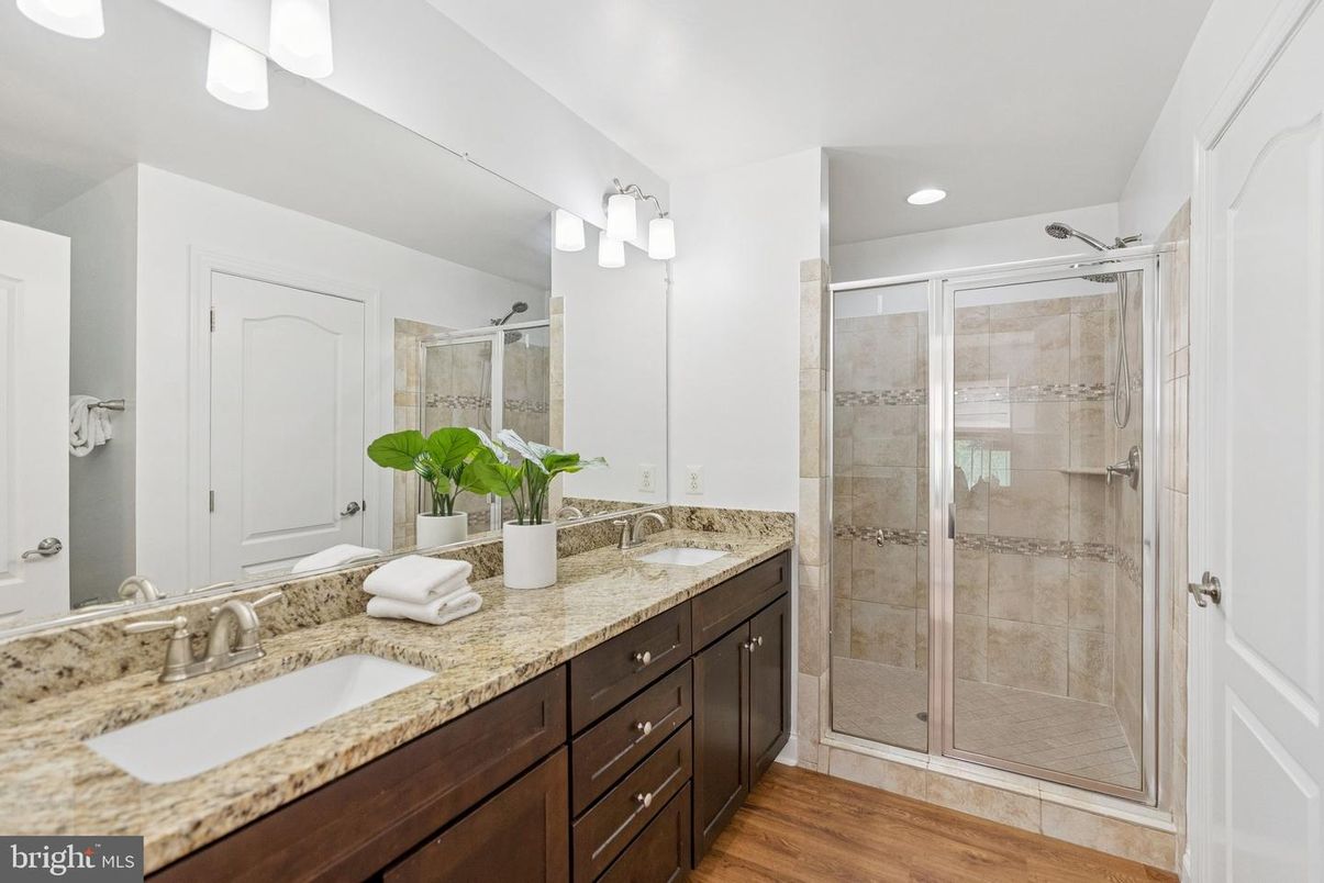 Bathroom, Dual Sink Vanities, Glass Shower, Interior, Recessed Lighting, Wood Texture Flooring