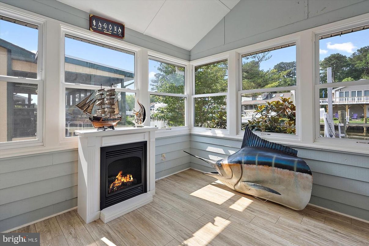 Fireplace, Interior, Sun Room, Wood Texture Flooring