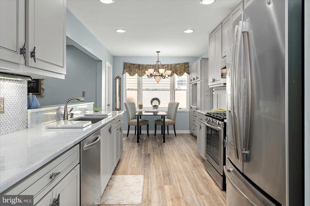 Chandelier, Dining room, Interior, Kitchen, Recessed Lighting, Stainless Steel Appliances, Wood Texture Flooring