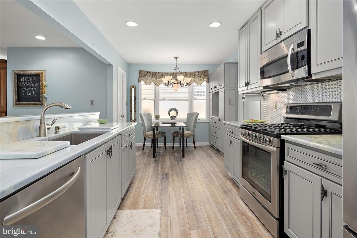 Chandelier, Dining room, Interior, Kitchen, Recessed Lighting, Stainless Steel Appliances, Wood Texture Flooring