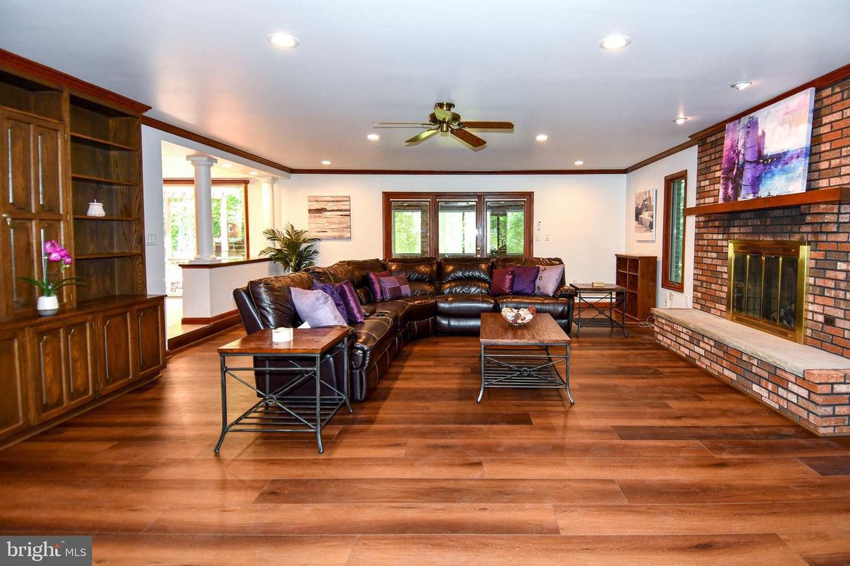 Fireplace, Interior, Living room, Recessed Lighting, Stone Walls, Wood Texture Flooring