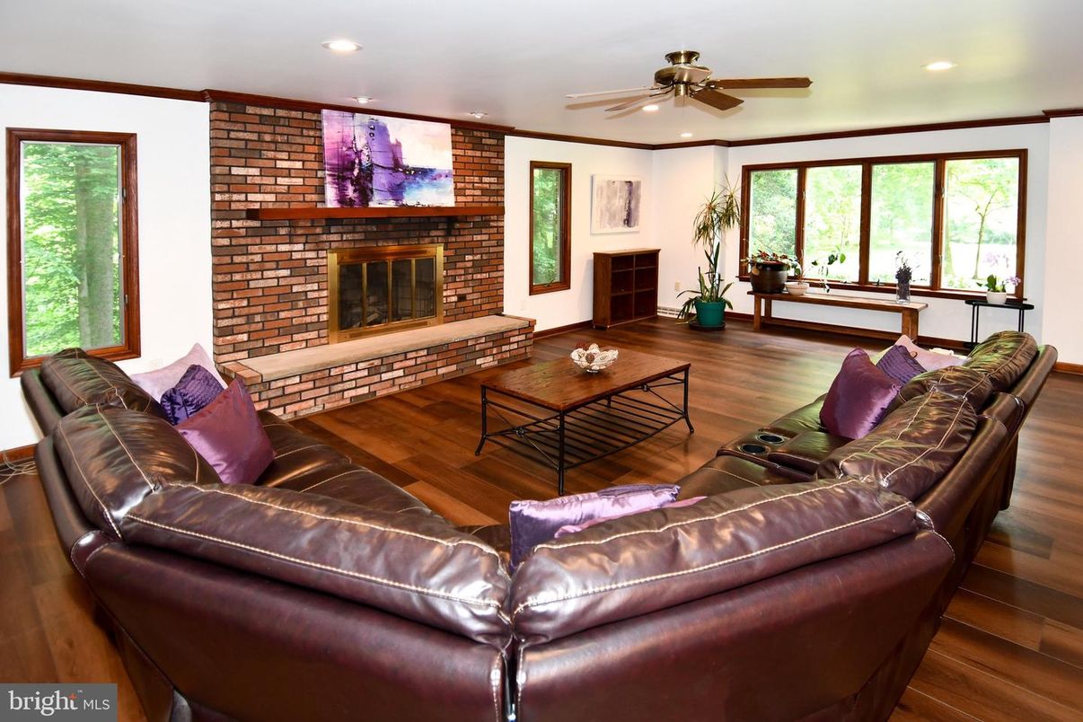 Fireplace, Interior, Living room, Recessed Lighting, Stone Walls, Wood Texture Flooring
