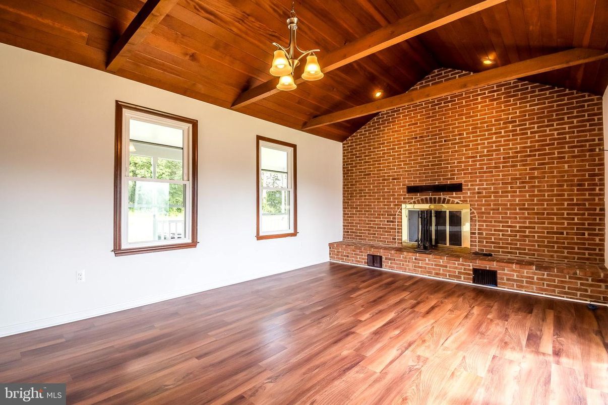 Empty room, Fireplace, Interior, Recessed Lighting, Stone Walls, Wooden Beams, Wooden Ceilings, Wood Texture Flooring