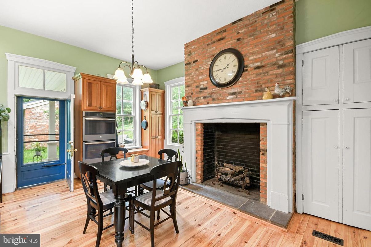 Dining room, Fireplace, Interior, Pendant Lights, Stone Walls, Wood Texture Flooring