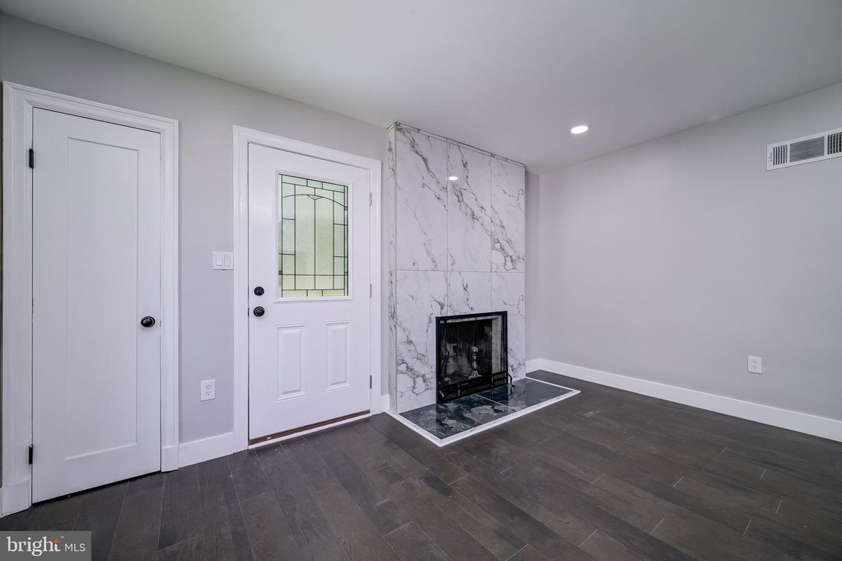 Fireplace, Interior, Marble Walls, Recessed Lighting, Wood Texture Flooring