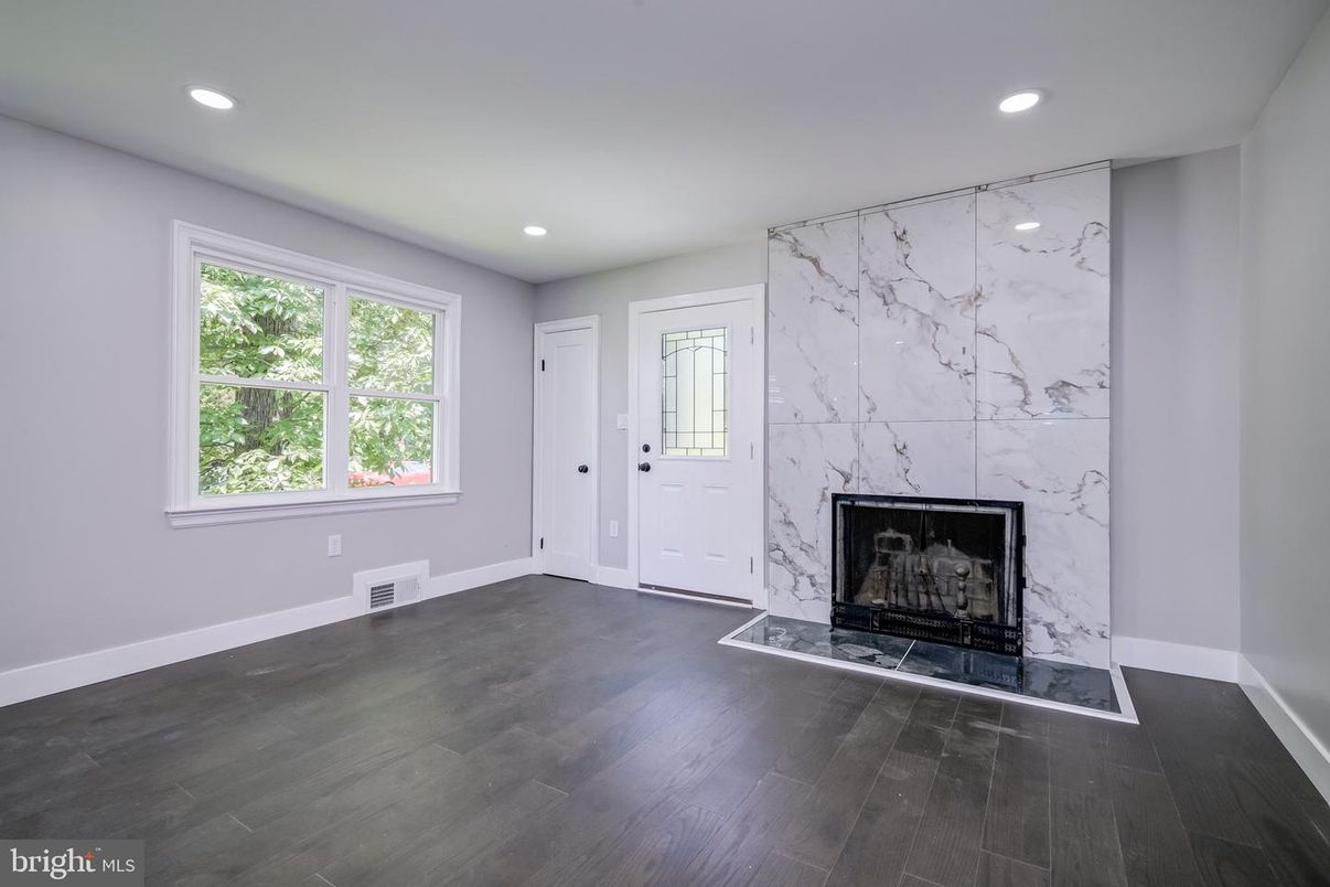 Fireplace, Interior, Marble Walls, Recessed Lighting, Wood Texture Flooring