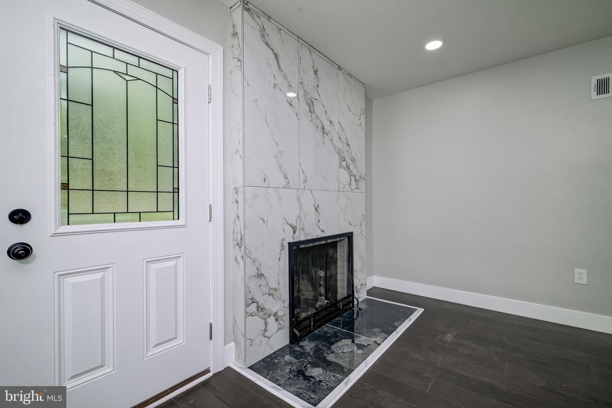 Fireplace, Interior, Marble Walls, Recessed Lighting, Wood Texture Flooring